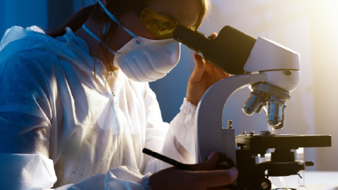 Picture of scientist using microscope